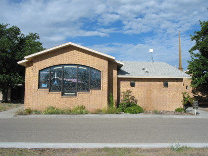 Front of the church featuring the Tombaugh Window