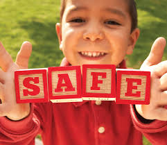 child holding blocks that spell word safe image of a child