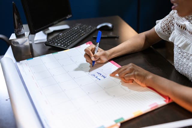 picture person marking a calendar with what is ahead this week